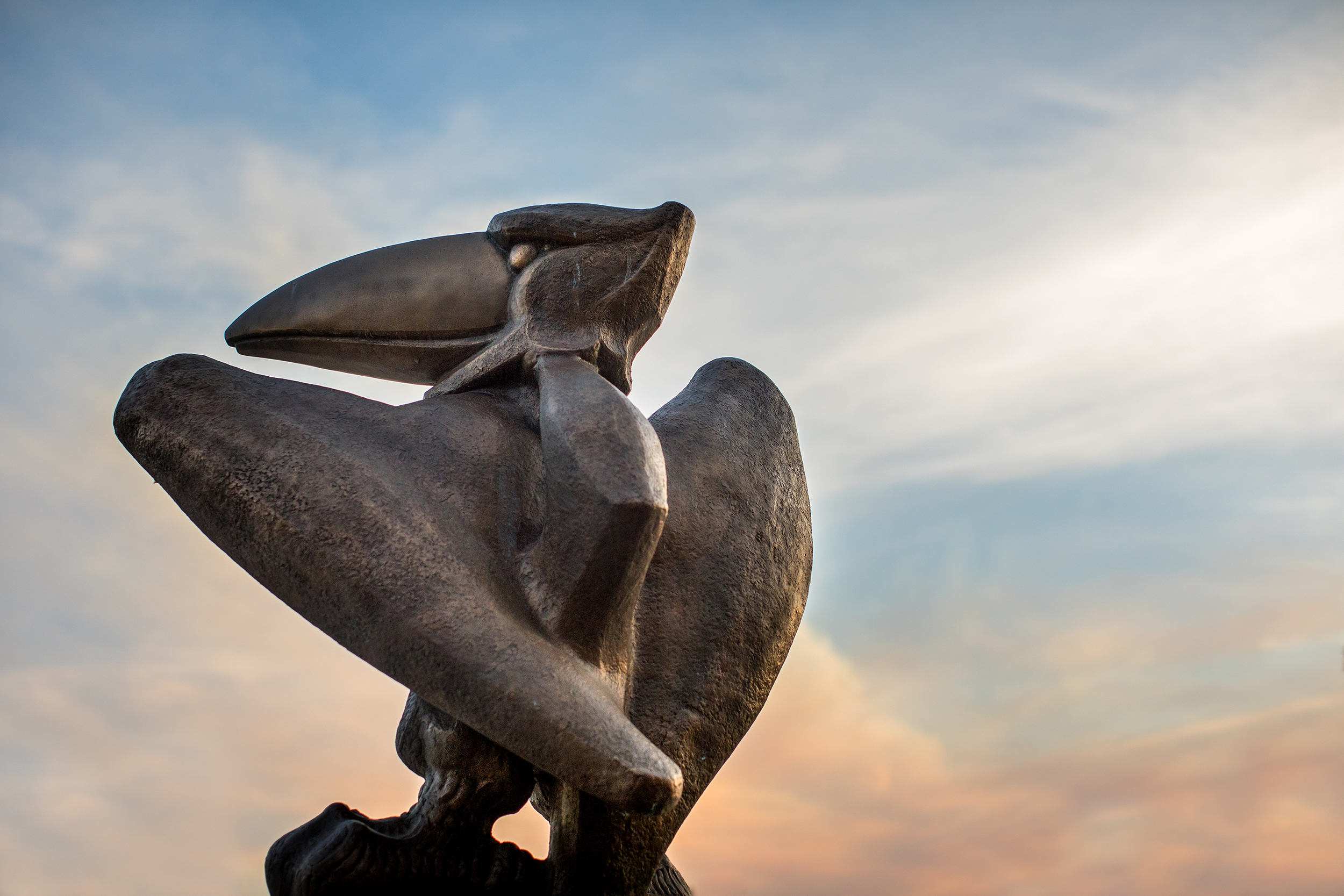 Strong Hall Jayhawk statue in sunset