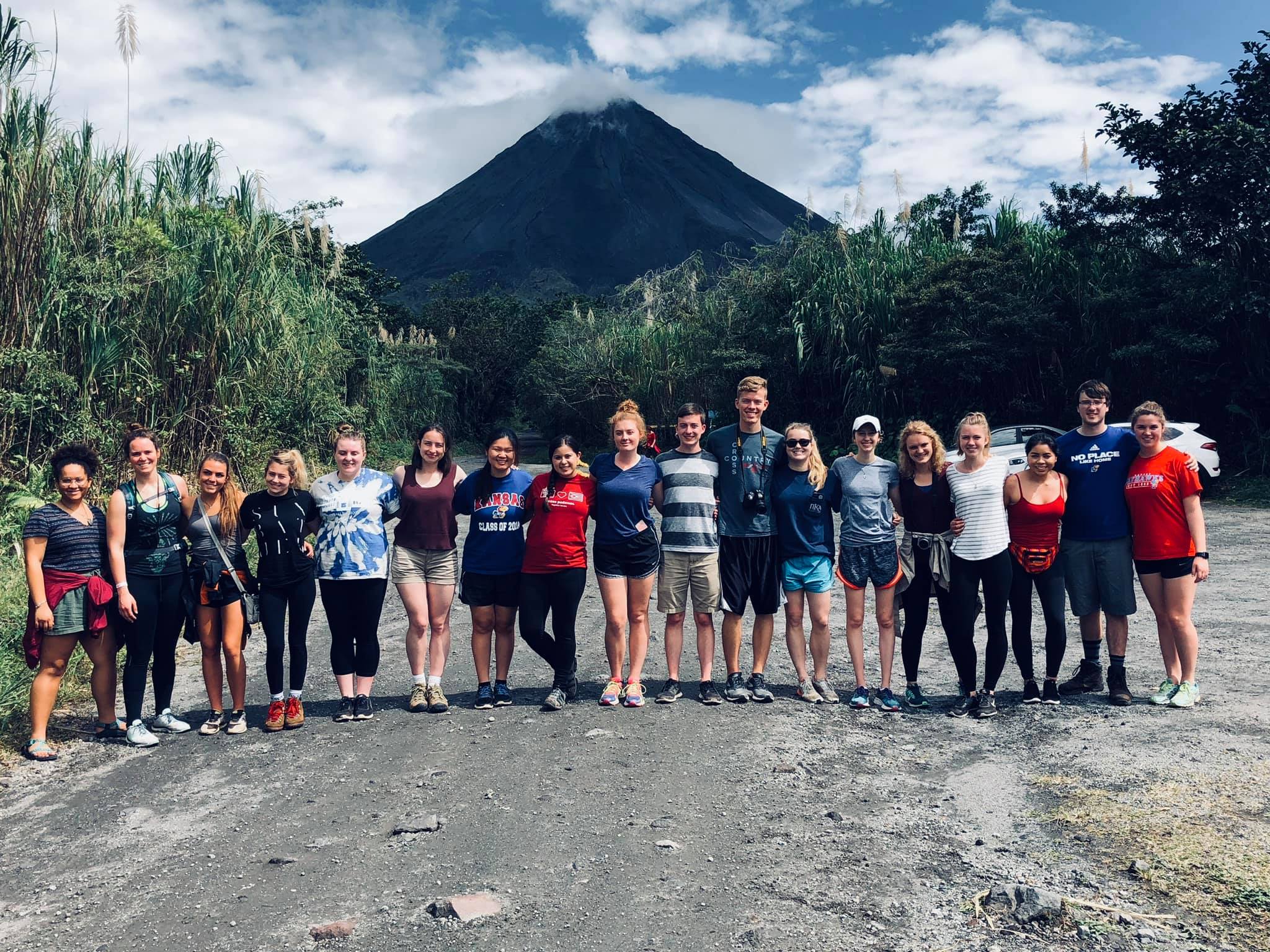 English students stand in front of a volcano in Costa Rica