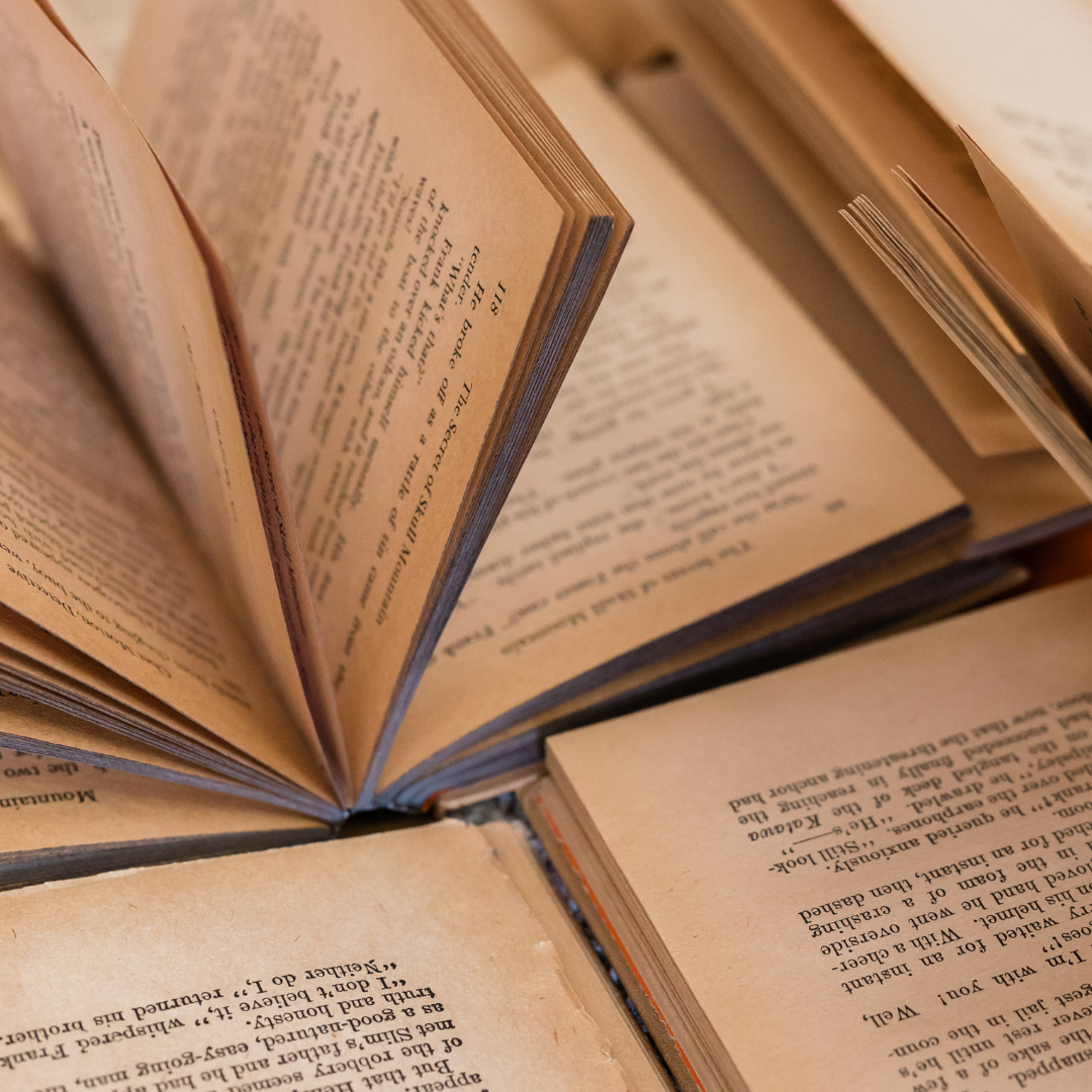 Several open books with yellowed pages