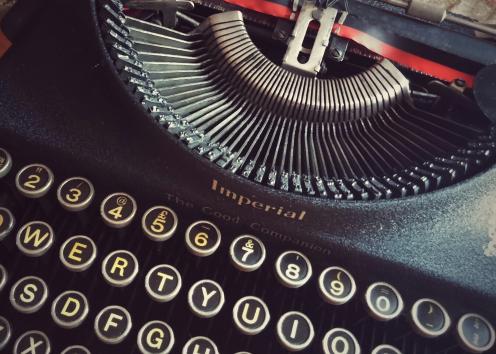 a very focused image of an antique typewriter