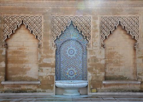 Ornate building with tiled fountain in Morocco